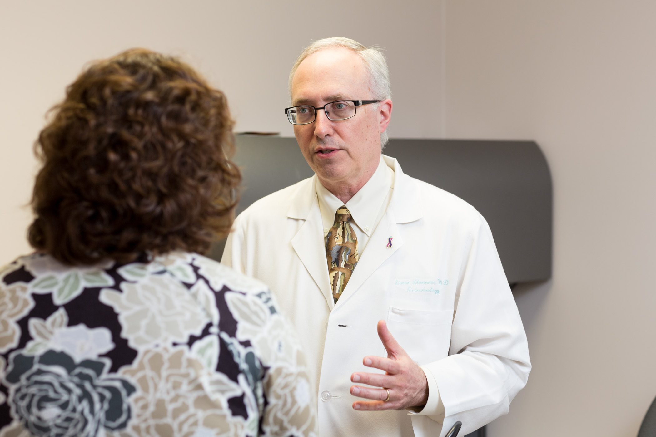 Steven Sherman, M.D., with a patient