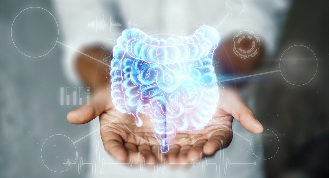 CGI anatomical drawing of electric blue small and large intestines superimposed over two open hands, held together, palm up