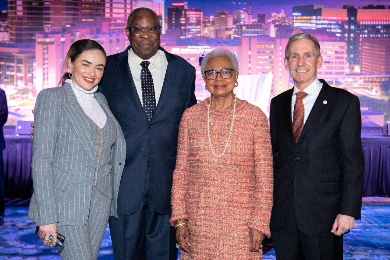 Honored guests pose with MD Anderson's president.