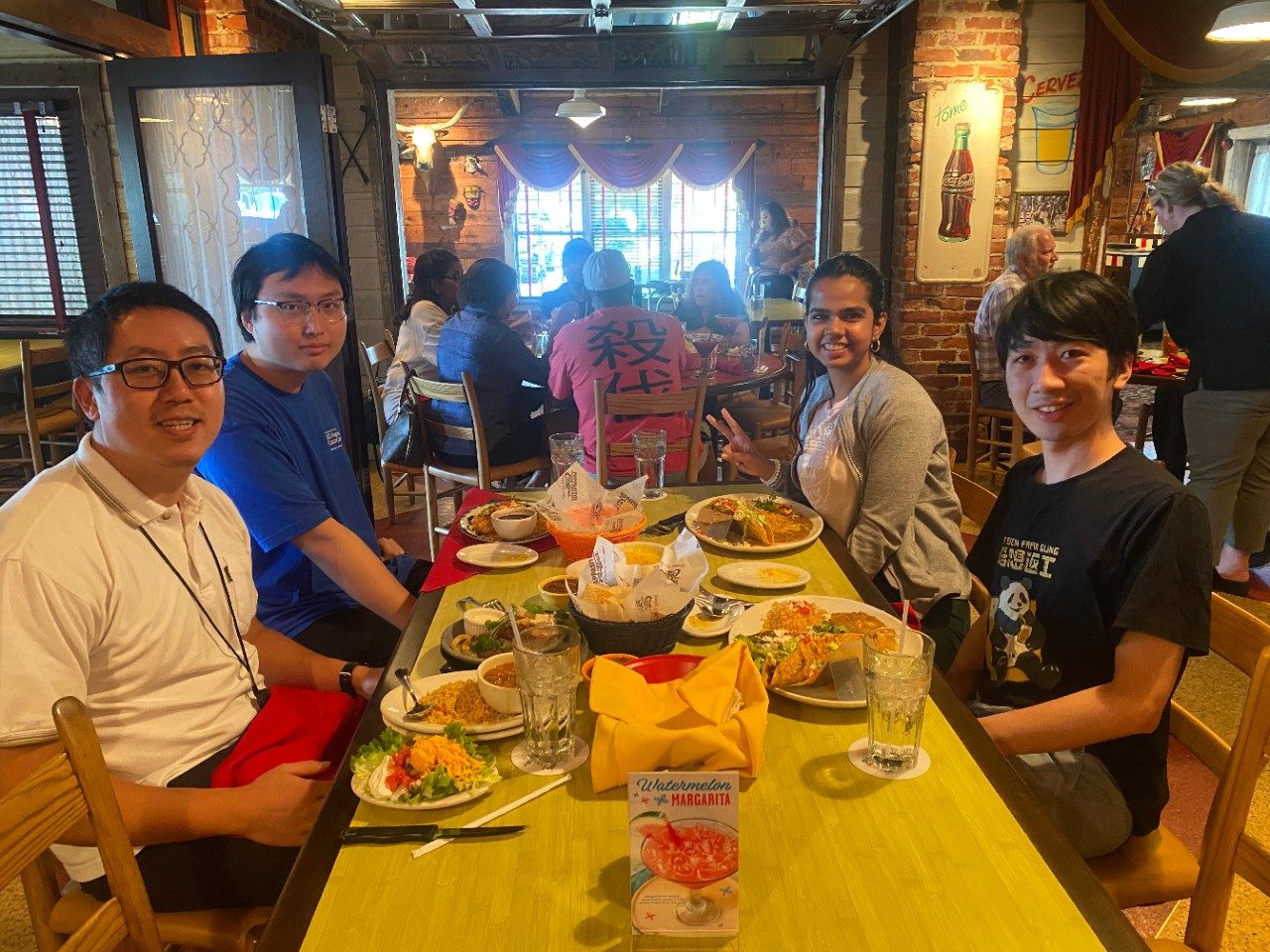 Four people seated around a table at a TexMex restaurant