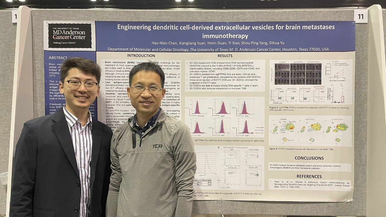 two men with a scientific poster